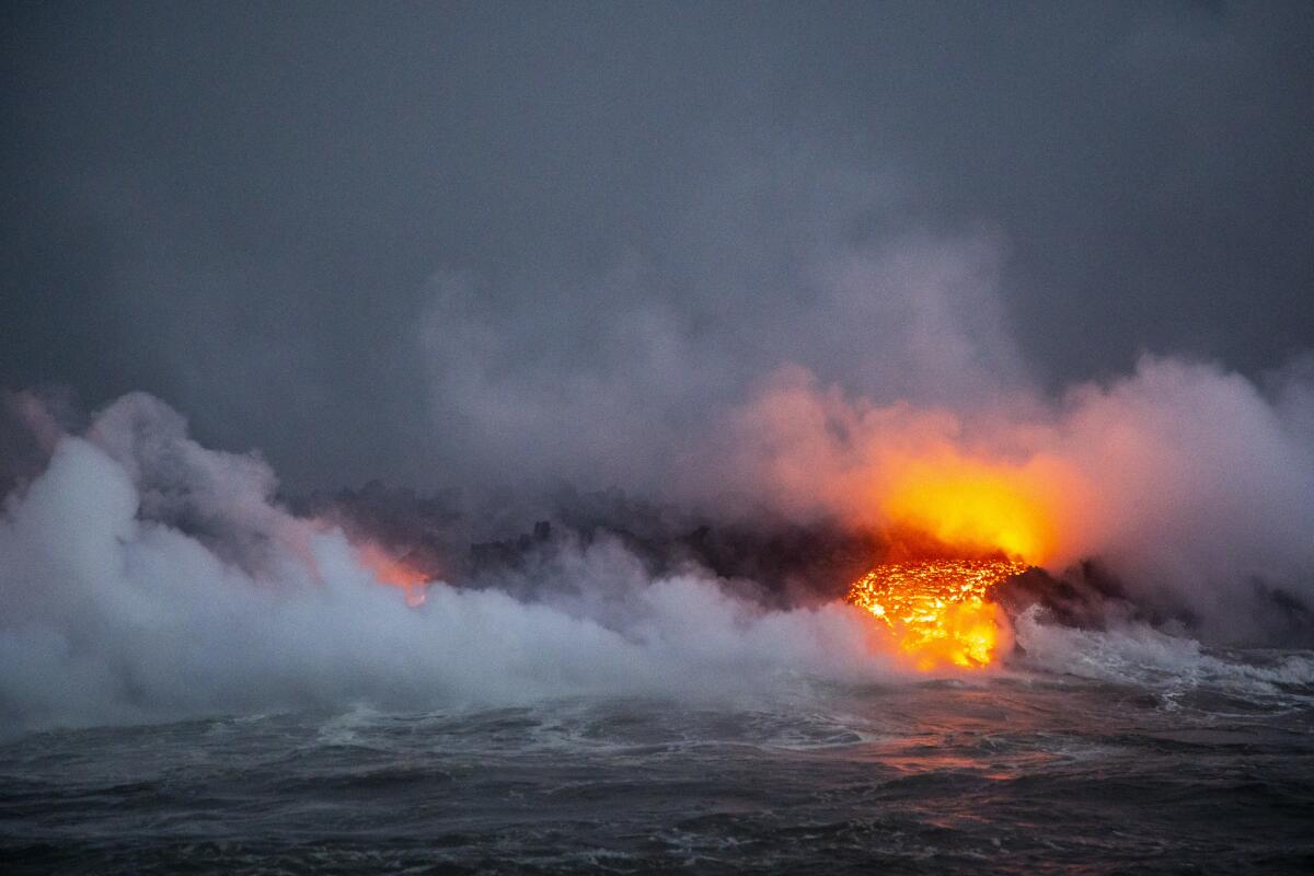 Lava flows into what used to be Kapoho Bay on the east coast of Hawaii's Big Island. Lava recently filled the entire bay and extended the coastline.
