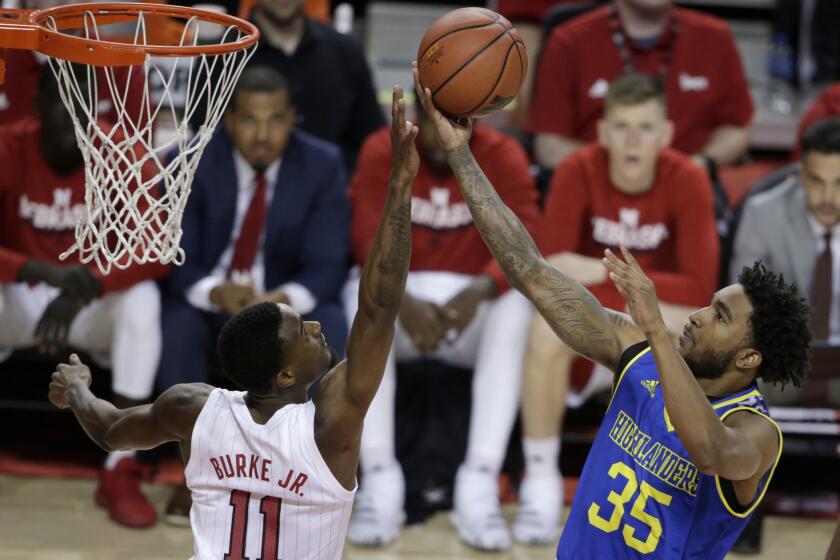 UC Riverside's George Willborn III (35) goes for a layup against Nebraska's Dachon Burke Jr. (11) during the first half of an NCAA college basketball game in Lincoln, Neb., Tuesday, Nov. 5, 2019. (AP Photo/Nati Harnik)