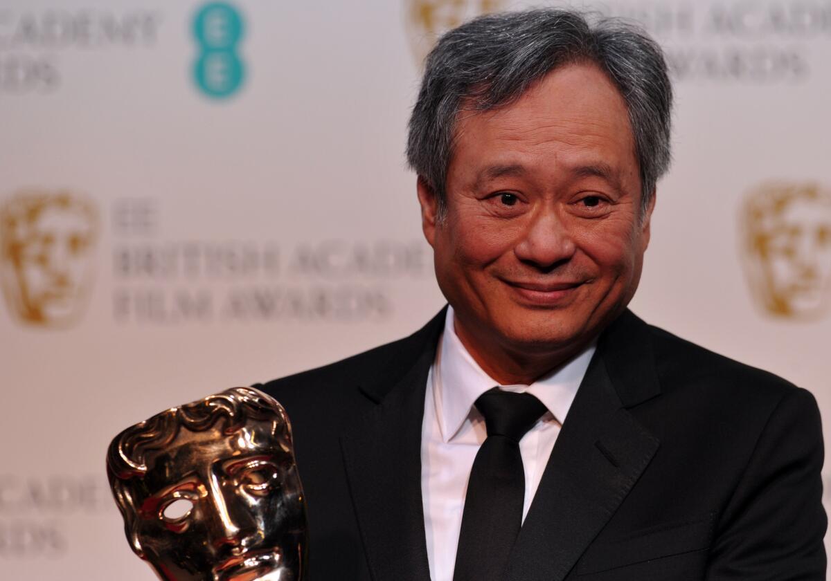 Ang Lee picks up the cinematography award for Claudio Miranda for his work on "Life of Pi" at the British Academy of Film and Television Arts Awards in London.