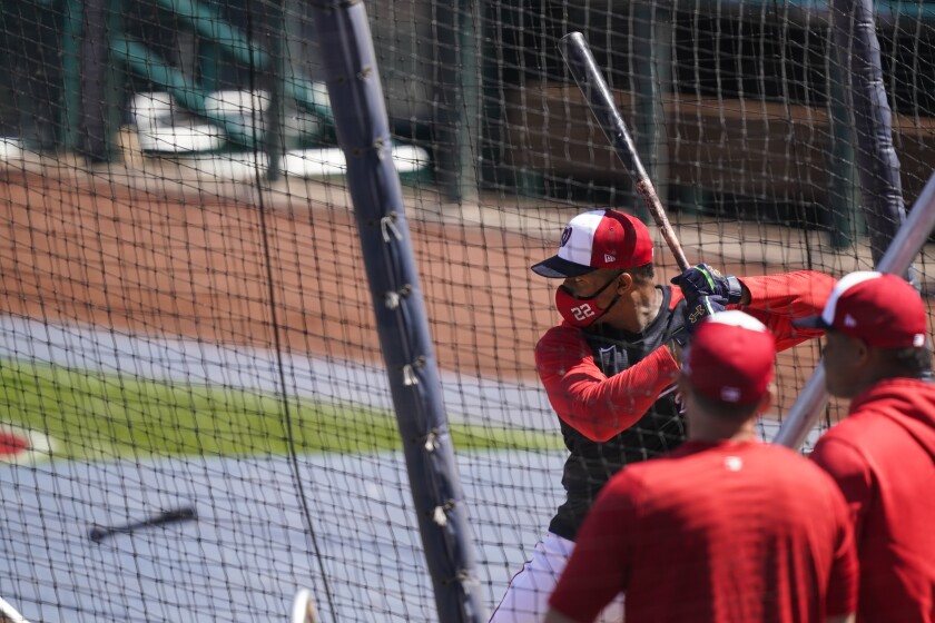 Washington Nationals' Juan Soto bats during a baseball workout at Nationals Park, Monday, April 5, 2021, in Washington. The Nationals are scheduled to play the Braves on Tuesday. (AP Photo/Alex Brandon)