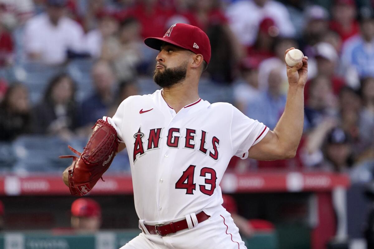 Angels starting pitcher Patrick Sandoval delivers in the first inning of a 7-2 loss to the Texas Rangers.