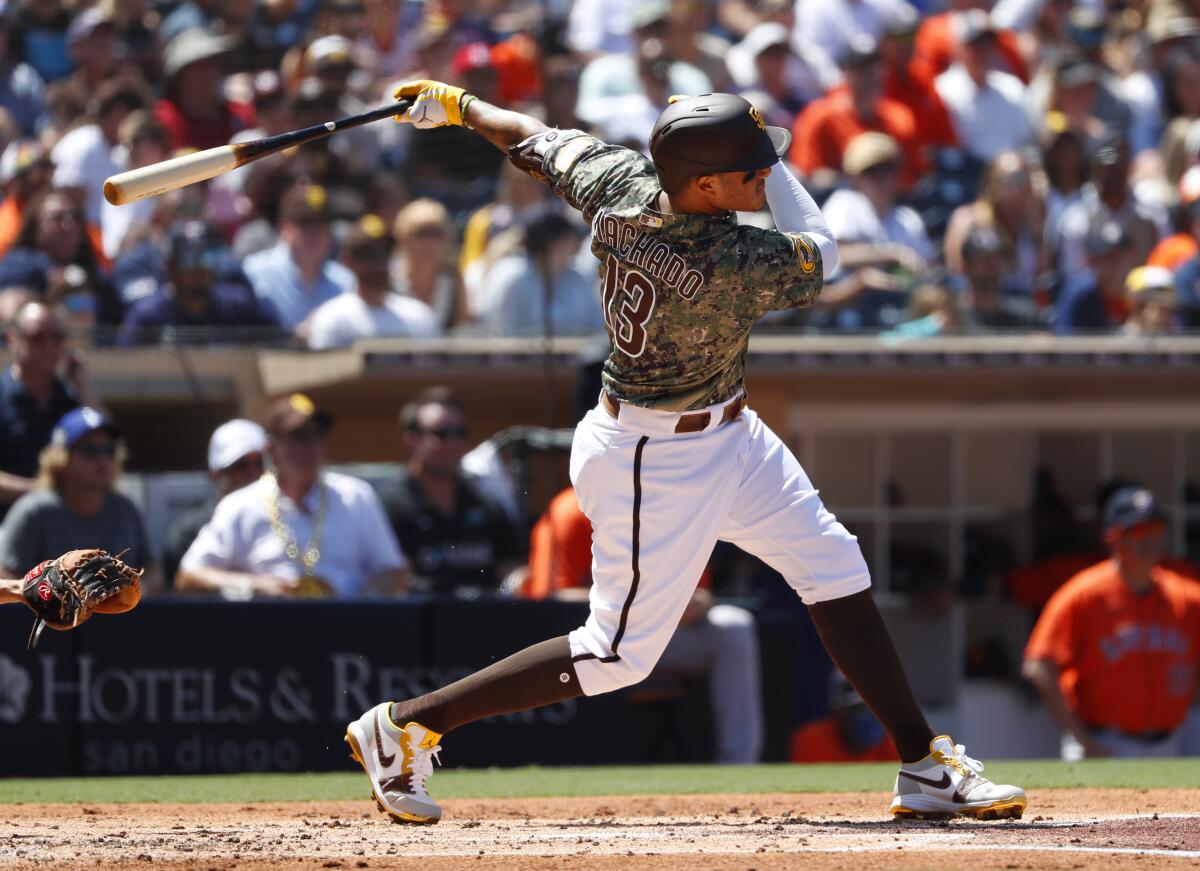 Manny Machado, hits a single in the first inning against the Houston Astros at Petco Park on Sunday.