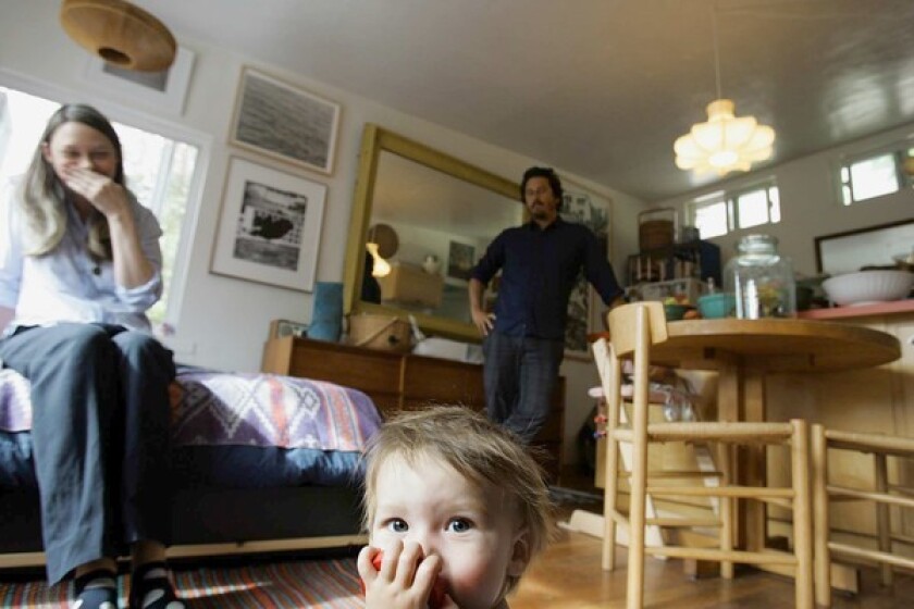 By David A. Keeps A lot of families start out in small houses – just not this small. Kelly Breslin, Ryan Conder and their 9-month-old son, Thurston, live in a 380-square-foot 1950s house in Echo Park with living quarters built above the garage. The family also makes room for a mutt named Charlie. Conder and Breslin insist they prefer living small and don't let it cramp their style. The space is arranged for maximum efficiency but maintains the vibe of an artist's loft with a carefully edited selection of contemporary art and midcentury Danish and Italian furniture. We recently dropped in on Breslin and Conder, owner of the men's clothing store South Willard. It wasn't an exhausting tour -- you're looking at about half of their home here -- but their designs for living (and parenting) were eye-opening.