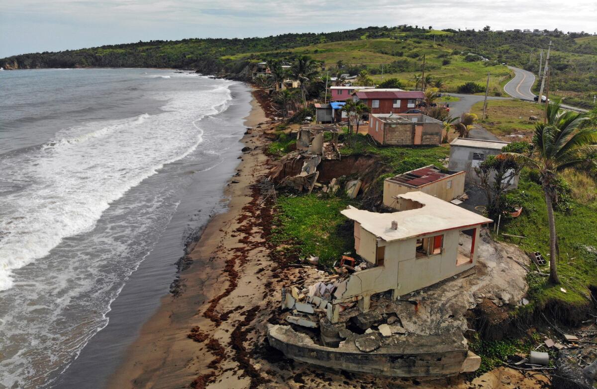 A year after Hurricane Maria, homes remain in ruins along the beach in Yabucoa, Puerto Rico.