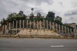 Los Angeles, CA - June 13: A set of pillars that locals call "Pillarhenge" stand at property in Eagle Rock is being developed into a multi-family, mixed-use complex on Tuesday, June 13, 2023 in Los Angeles, CA. (Jason Armond / Los Angeles Times)