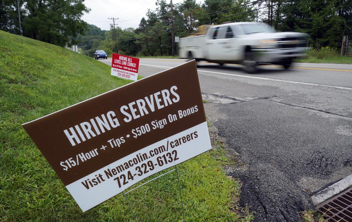 "Help wanted" signs for servers and cooks in Farmington, Pa.
