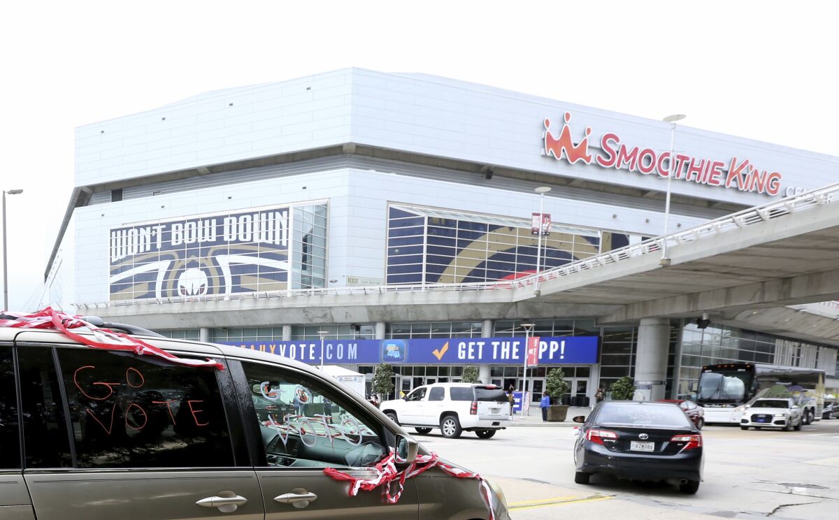 Cars pull up to the Smoothie King Center