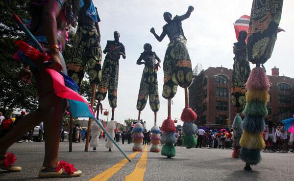 Stilt walkers perform at the West Indian-American Day Parade, an American celebration based on Carnival.