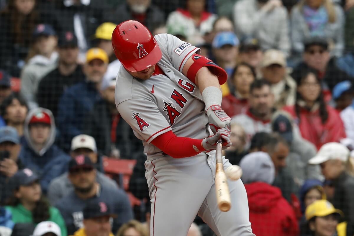 Hunter Renfroe hits a three-run home run during the first inning for the Angels against the Boston Red Sox.
