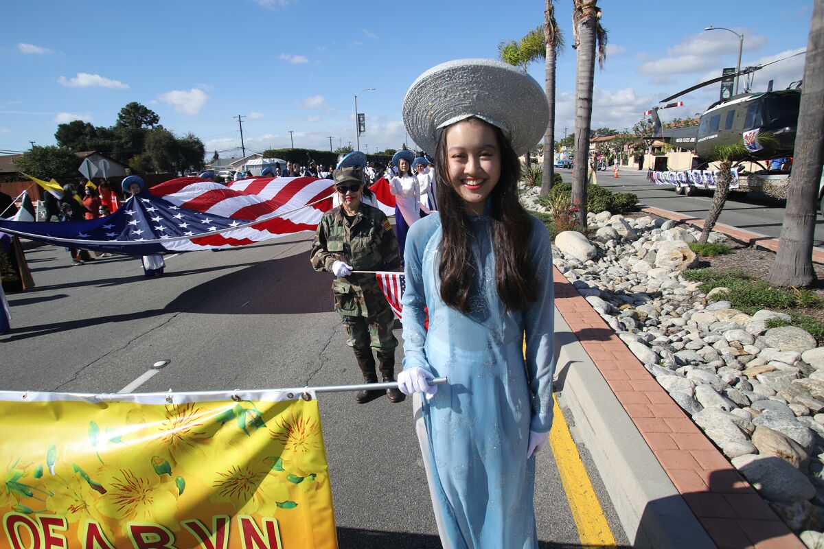 Janine Nguyen takes part in the 2023 Westminster Tết Parade along Bolsa Avenue in Westminster.