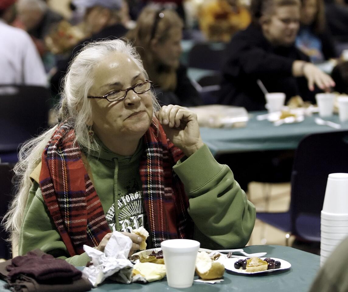 Michel Lebleu of Glendale enjoys a Thanksgiving meal at the Glendale Salvation Army's Thanksgiving Lunch event on Thursday, November 24, 2011.