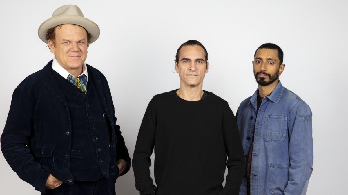 John C. Reilly, from left, Joaquin Phoenix and Riz Ahmed, from the film "The Sisters Brothers," are photographed in the L.A. Times Photo and Video Studio at the 2018 Toronto International Film Festival.