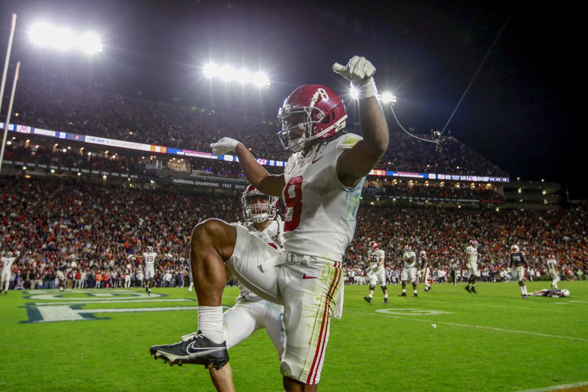 Alabama wide receiver John Metchie celebrates after scoring during the fourth overtime.