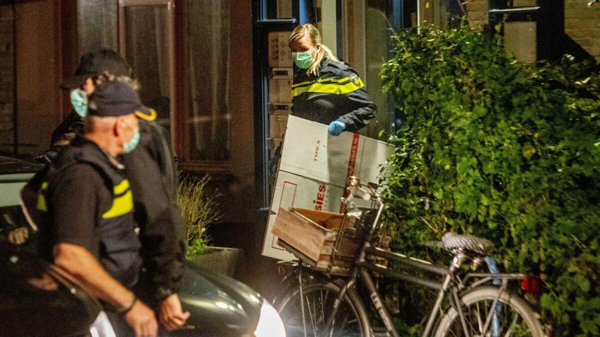 Dutch police search the residence of an alleged member of an extremist cell Thursday in Vlaardingen, Netherlands.