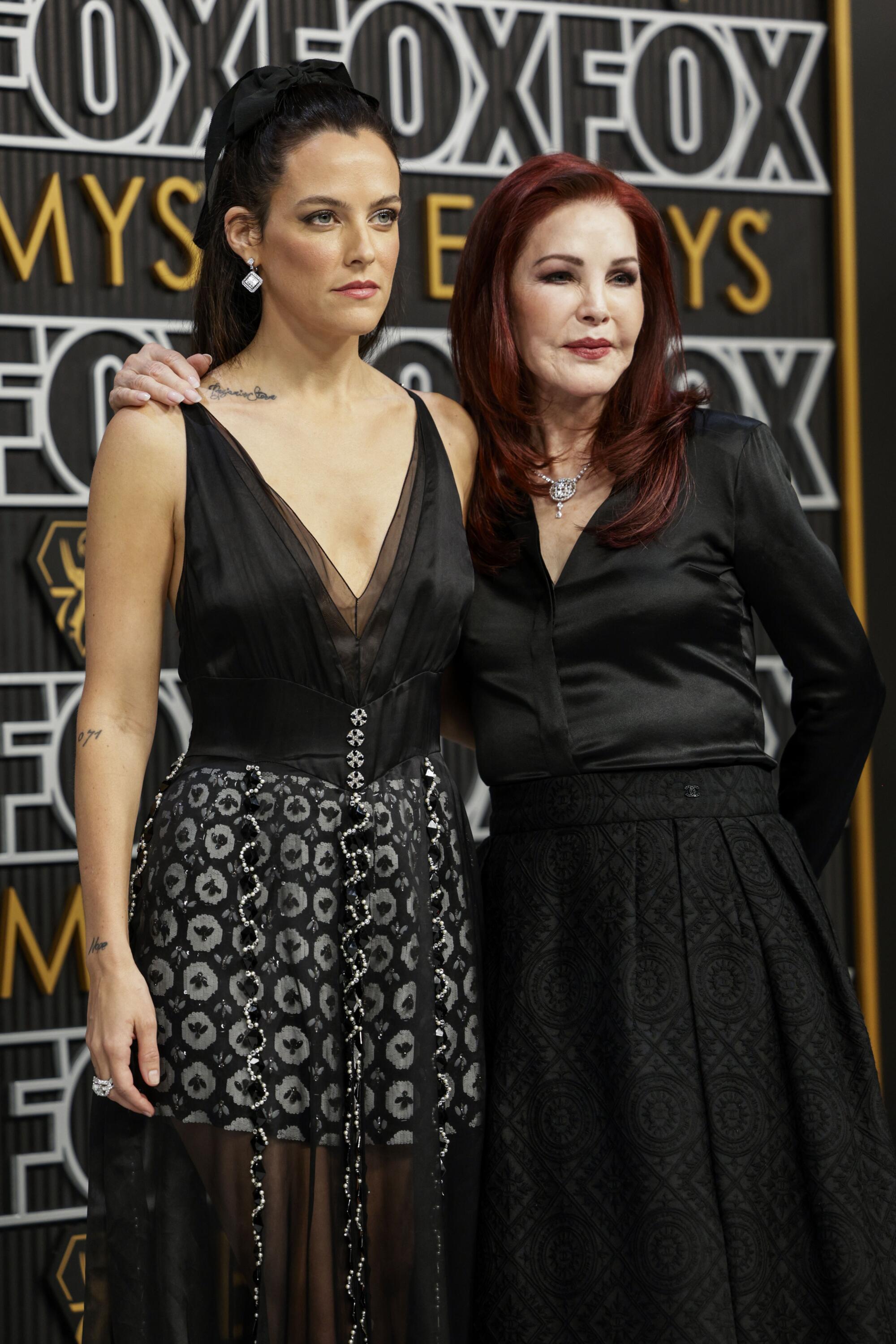 Riley Keough and Priscilla Presley pose on the Emmys red carpet.