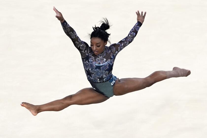 Simone Biles, of United States, performs on floor exercise during a women's artistic gymnastics.
