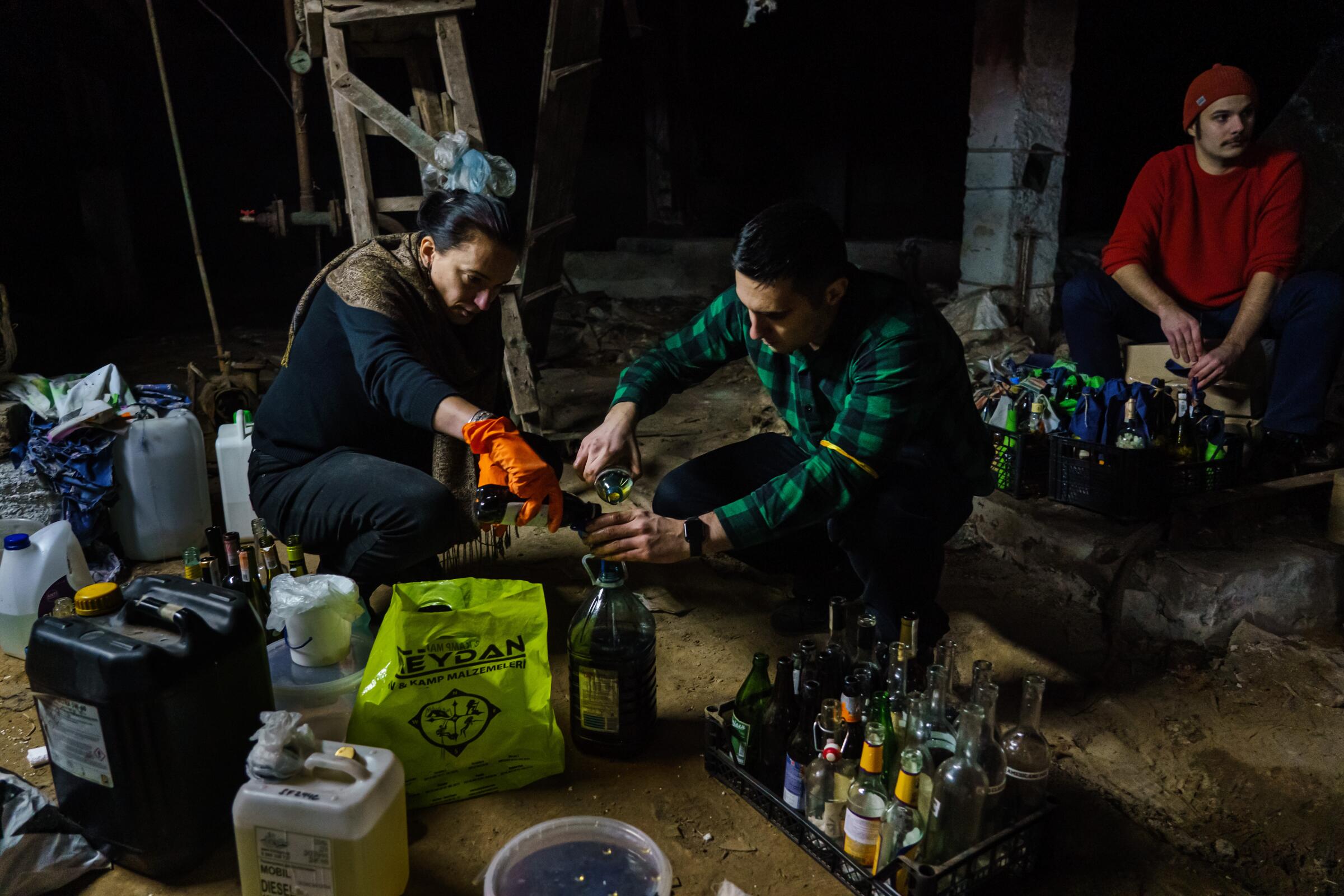 Volunteers make Molotov cocktails.
