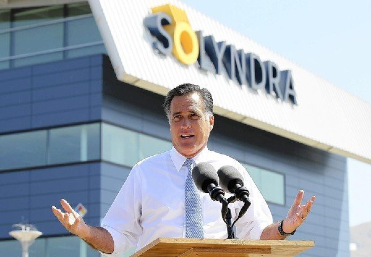 Mitt Romney speaks at a news conference in front of the shuttered Solyndra facility in Fremont, Calif.