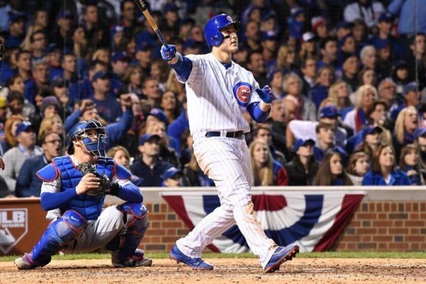 CHICAGO, ILLINOIS OCTOBER 22, 2016-Cubs Anthony Rizzo hits a solo home run off Dodgers pitcher Clayton Kershaw in the 5th inning in Game 6 of the NLCS at Wrigley Field in Chicago Saturday. (Wally Skalij/Los Angeles Times)