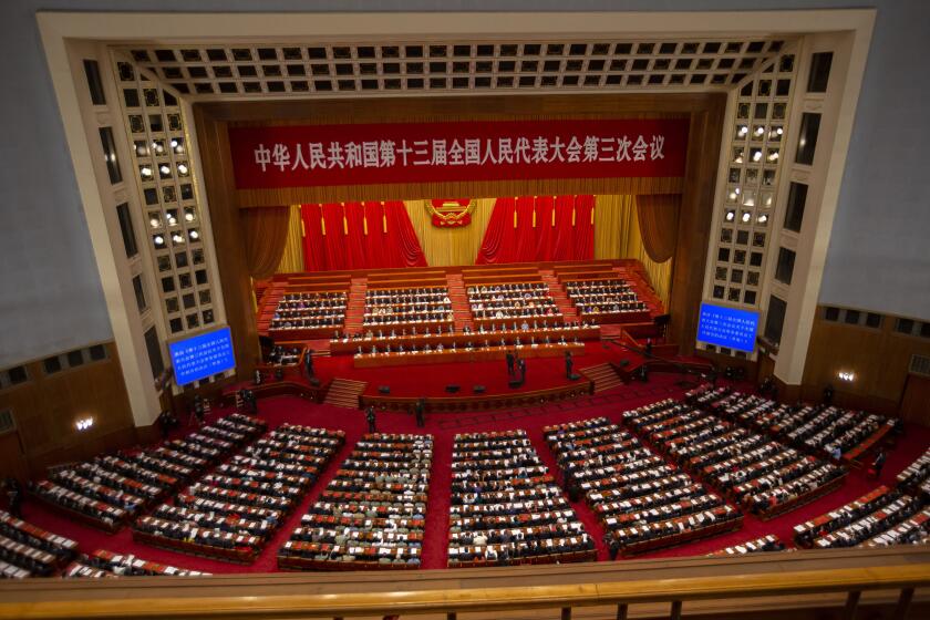 FILE - Delegates and Chinese leaders attend the closing session of China's National People's Congress (NPC) in Beijing on May 28, 2020. China's 3,000-member ceremonial parliament will open its annual session Saturday, March 5, 2022 with the government facing a slowing economy and international pressure over its stance on Russia's invasion of Ukraine. (AP Photo/Mark Schiefelbein, File)