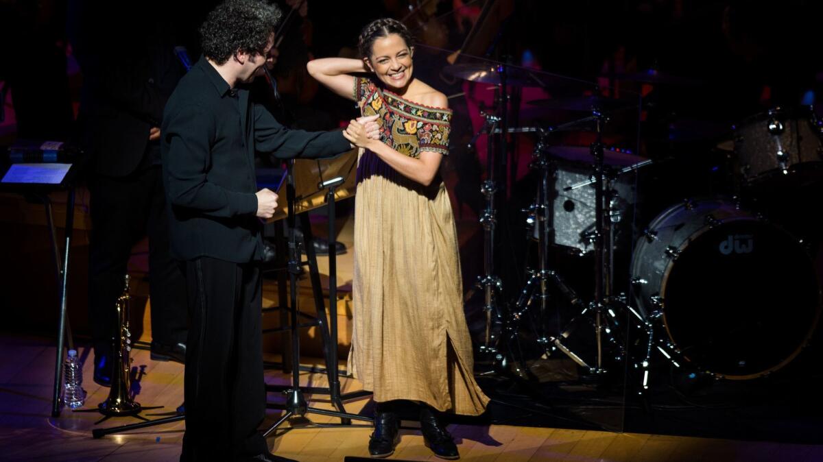 Gustavo Dudamel with singer Natalia Lafourcade at Thursday's opening concert of the Los Angeles Philharmonic's CDMX festival at Walt Disney Concert Hall.