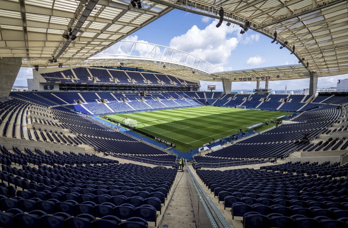 FILE - In this Tuesday, June 4, 2019 file photo, a general view of the Dragao stadium in Porto, Portugal. The path has been cleared for Porto to stage the Champions League final between Chelsea and Manchester City after Portuguese authorities approved the return of supporters to stadiums. UEFA is planning to announce by the end of the week that the 50,000-capacity Estádio do Dragão will be used for the May 29 showpiece with thousands of fans from both English clubs set to be allowed into the game. (AP Photo/Luis Vieira, File)