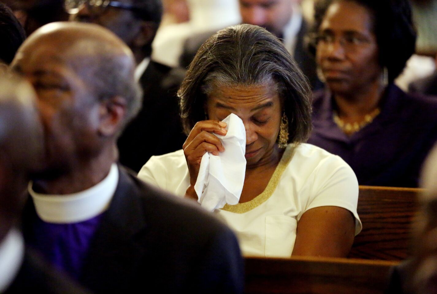 Marie Goff wipes away tears during a prayer vigil at Morris Brown AME Church in Charleston, S.C., on Thursday for the victims of the previous day's shooting at the city's Emanuel AME Church.