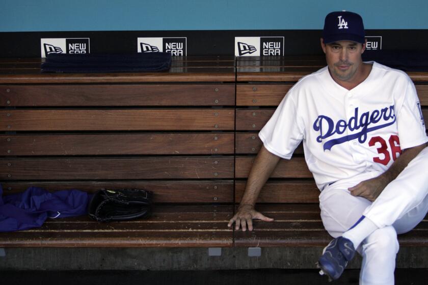 Greg Maddux, shown in the dugout in 2006, is back with the Dodgers, this time in the front office.