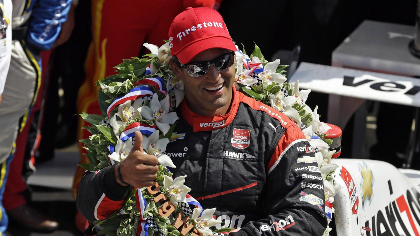 Juan Pablo Montoya celebrates after winning the Indianapolis 500 on May 24, 2015.