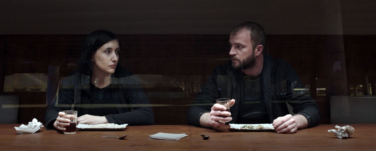 Liudmyla Bileka and Andriy Rymaruk have a drink in the movie "Atlantis."