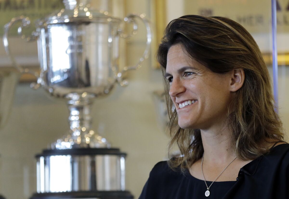 FILE - Amelie Mauresmo, of France, speaks during an interview at the International Tennis Hall of Fame, Saturday, July 16, 2016, in Newport, R.I. Two-time major champion Amelie Mauresmo has been appointed the new director of the French Open Grand Slam tournament as a replacement for Guy Forget, becoming the first woman to hold the position. (AP Photo/Elise Amendola, File)