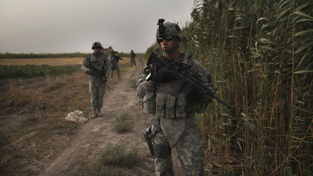 U.S. soldiers participate in a patrol in the Babil Province, Iraq on July 15, 2011.