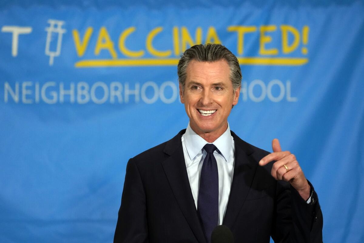 California Gov. Gavin Newsom announces a massive jackpot as the nation's most populous state looks to encourage millions of people who are still unvaccinated to get their shots at a news conference at the Esteban E. Torres High School in Los Angeles, Thursday, May 27, 2021. California is giving away the country's largest pot of vaccine prize money — $116.5 million — in an attempt to get millions more inoculated before the most populous U.S. state fully reopens next month. Newsom announced the prizes, which also include the nation's highest single vaccine prize: $1.5 million. (AP Photo/Damian Dovarganes)