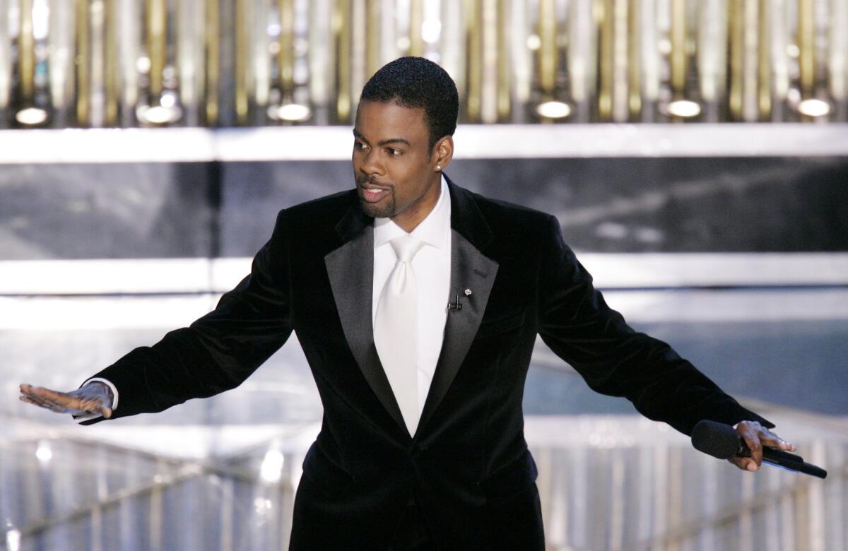 Oscar Host Chris Rock performs his monologue to open the 77th Academy Awards telecast in Los Angeles on Feb. 27, 2005. Rock hosts again this Sunday evening.
