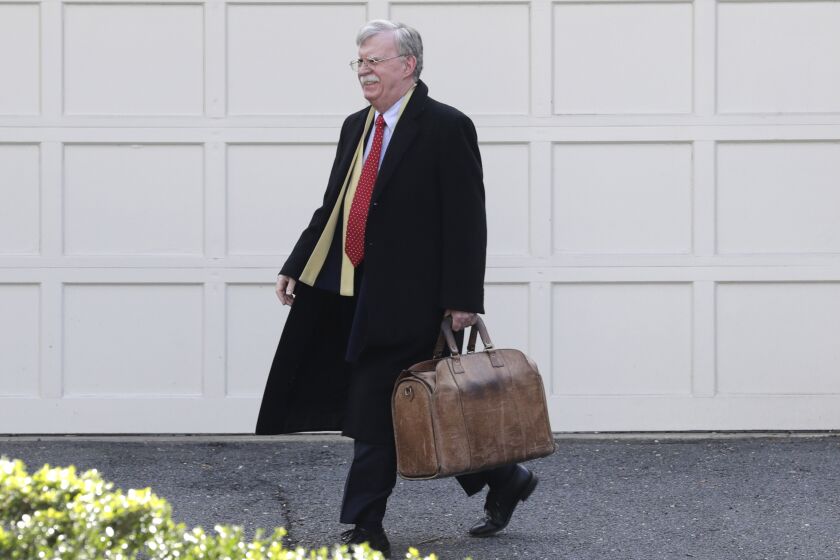Former National security adviser John Bolton leaves his home in Bethesda, Md. Tuesday, Jan. 28, 2020. President Donald Trump's legal team is raising a broad-based attack on the impeachment case against him even as it mostly brushes past allegations in a new book that could undercut a key defense argument at the Senate trial. Former national security adviser John Bolton writes in a manuscript that Trump wanted to withhold military aid from Ukraine until it committed to helping with investigations into Democratic rival Joe Biden. (AP Photo/Luis M. Alvarez)