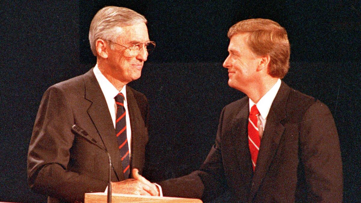 Lloyd Bentsen, left, and Dan Quayle shaking hands at a 1988 vice presidential debate.