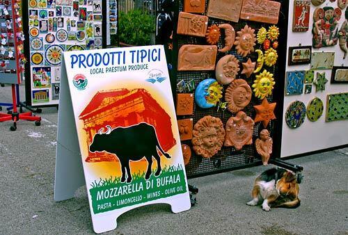 This billboard advertises a mozzarella dairy outlet near the Greek ruins of Paestum