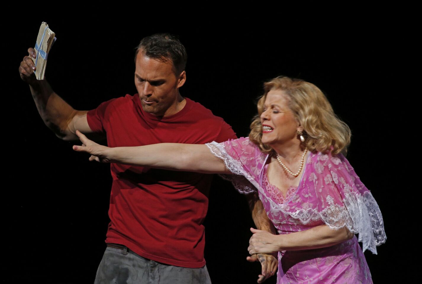 Ryan McKinny, who plays Stanley Kowalski, and Renée Fleming, as Blanche Dubois, rehearse a scene in the L.A. Opera production of André Previn's first opera, "A Streetcar Named Desire."