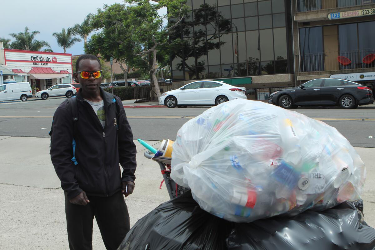 China's recycling policy changes have altered life for Vince Robertson, who now must travel further and get paid less for his recyclables.