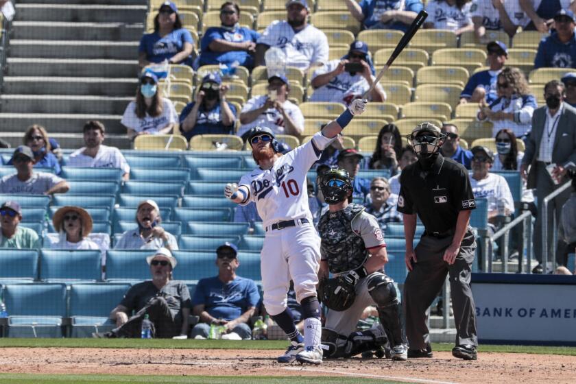 The Dodgers' Justin Turner connects for a solo homer in the sixth inning against the Nationals on April 9, 2021.