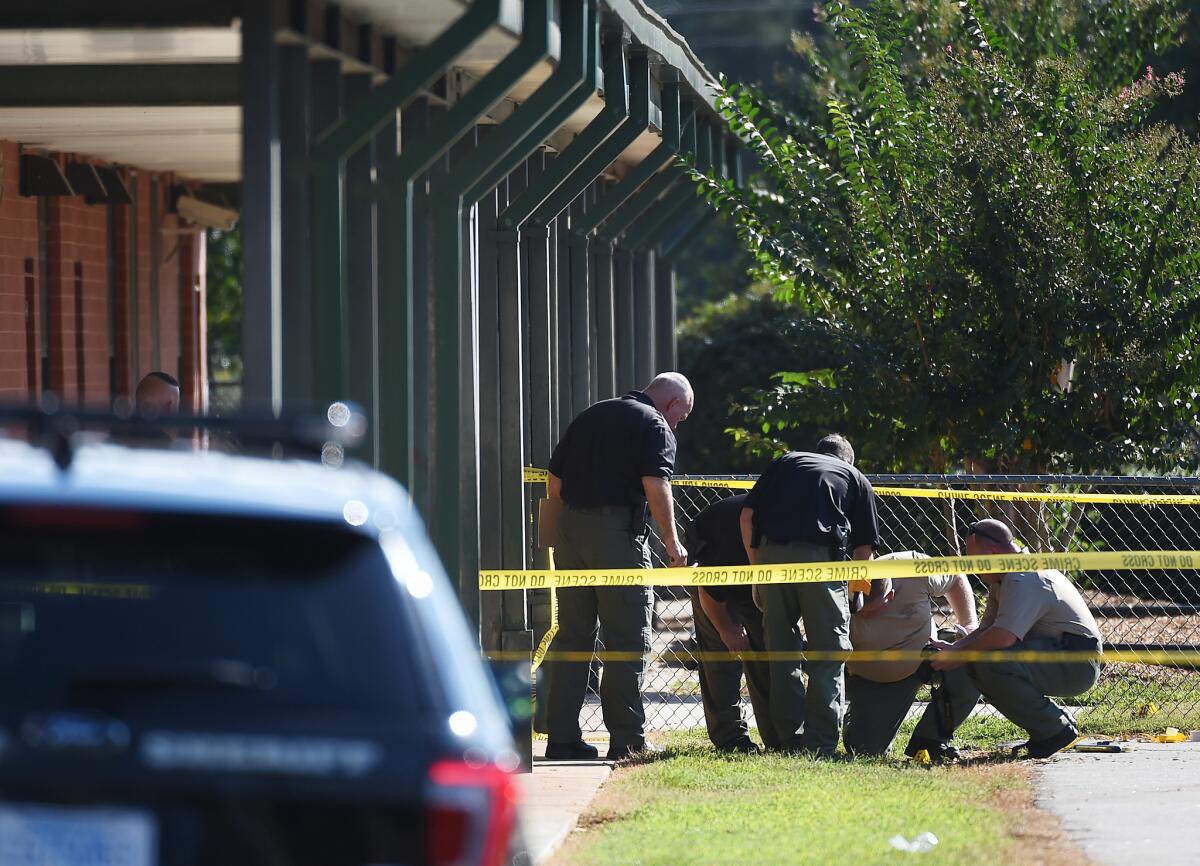 Law enforcement officers investigate at Townville Elementary School in Townville, S.C., on Wednesday.