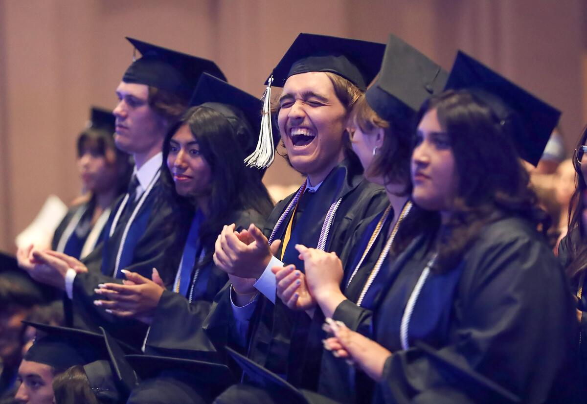 Decorated graduates are asked to stand during the Early College High School commencement ceremony at OCC on Thursday.