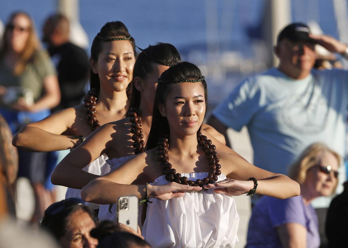 Members of the Halau Hula Hokulani dance group share a tradition Hawaiian dance.