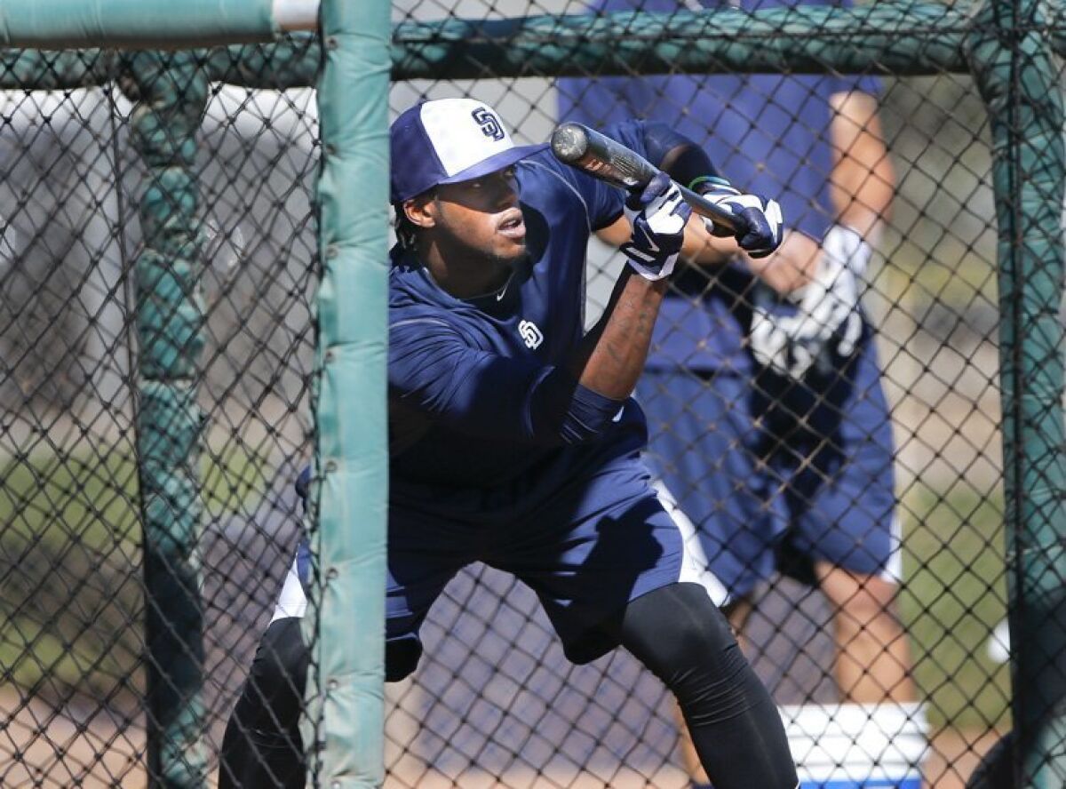 Padres outfielder Cameron Maybin takes bunting practice.
