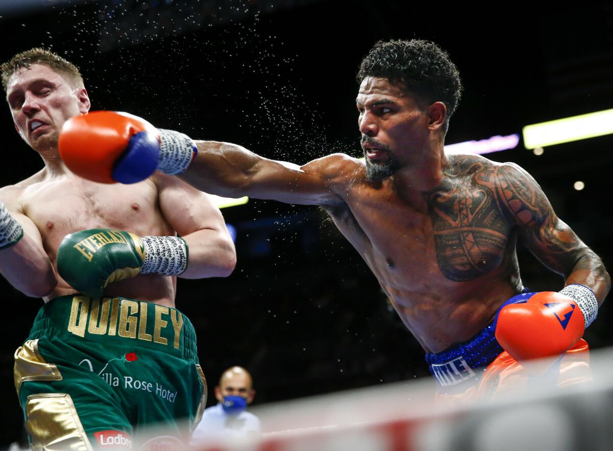 Shane Mosley Jr. punches Jason Quigleyduring during their middleweight boxing match 