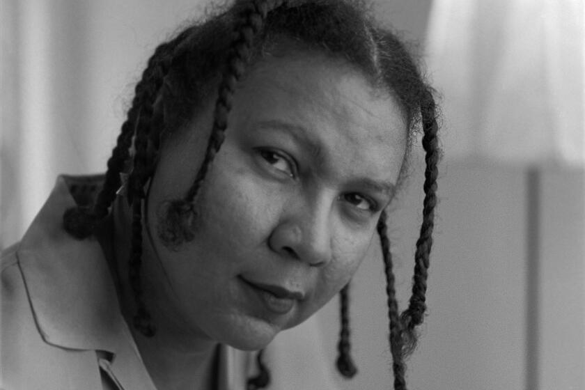 Author bell hooks, photographed in 1996, has died.