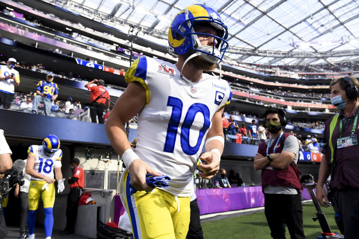 Rams wide receiver Cooper Kupp (10) makes his way onto the field for warm ups before Super Bowl LVI.