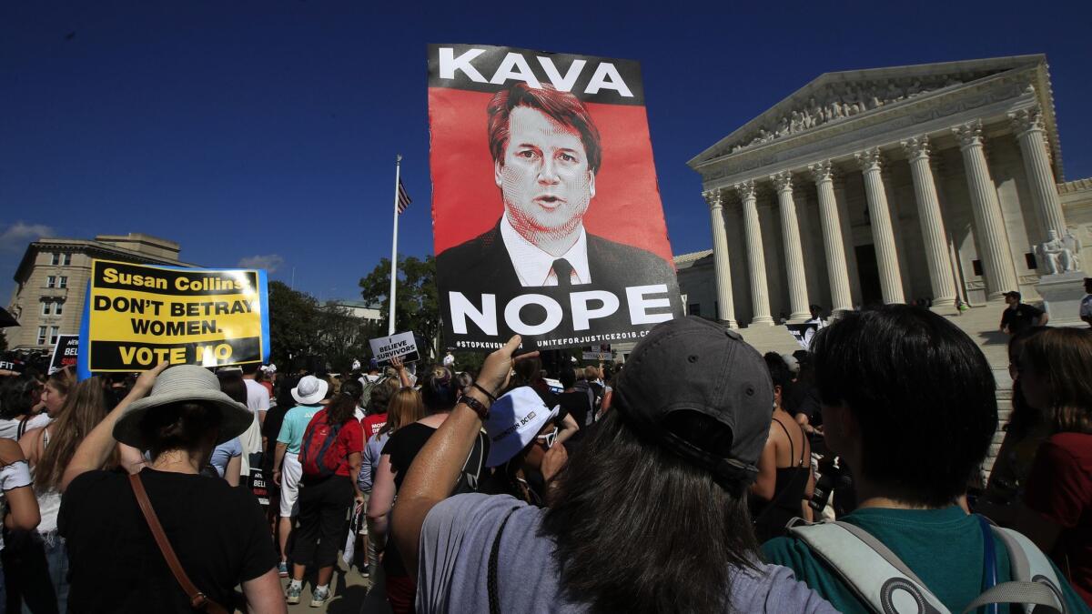 Protesters against Supreme Court nominee Brett Kavanaugh demonstrate outside the Supreme Court in Washington on Oct. 4.