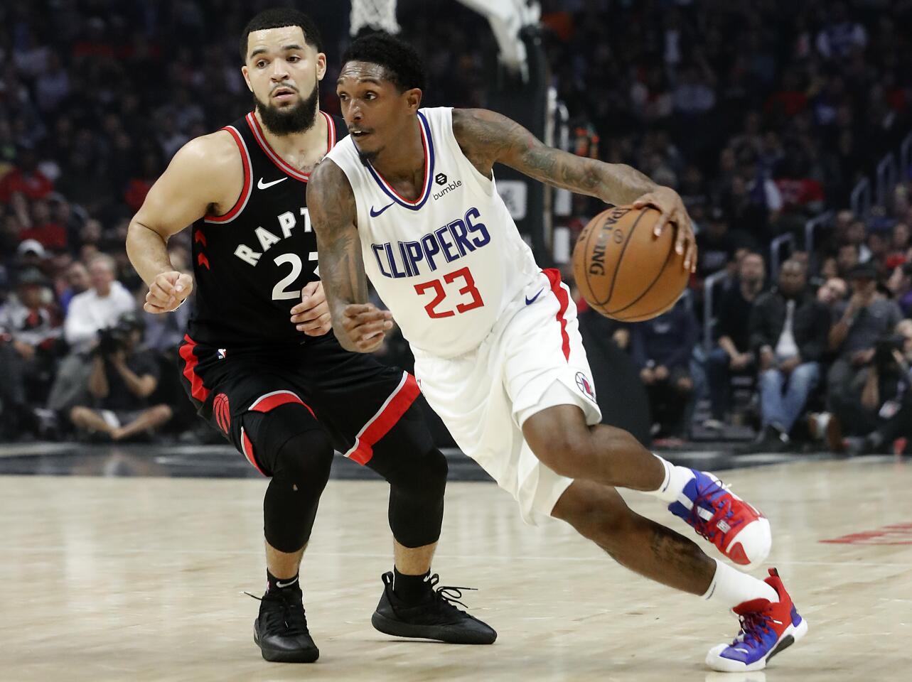 Clippers guard Lou Williams drives to the basket past Raptors guard Fred VanVleet during a game Nov. 11 at Staples Center.