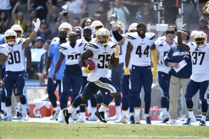 Los Angeles Chargers running back Troymaine Pope (35) returns a punt for a touchdown against the New Orleans Saints during the first half of a preseason NFL football game Sunday, Aug. 18, 2019, in Carson, Calif. (AP Photo/Kelvin Kuo )